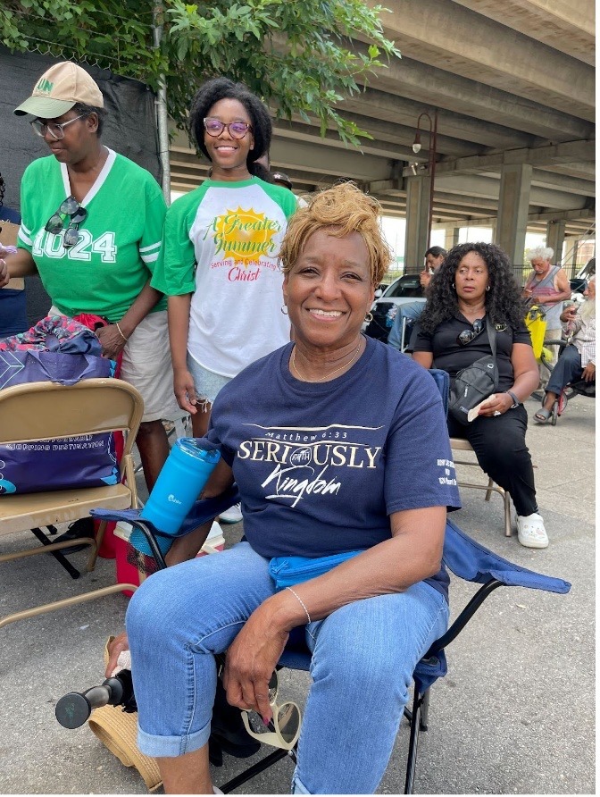Minister Jerri Thomas of Community of Faith Church offering encouragement.