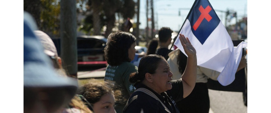 Faith leaders and community members participate in an interfaith protest opposing ICE raids in the New Orleans area.