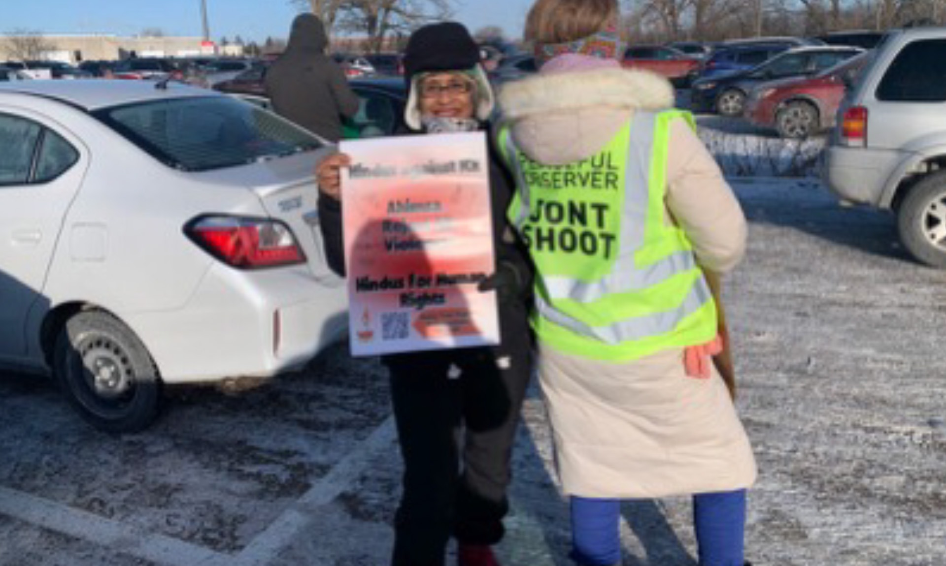 Author Sunita Viswanath and a fellow demonstrator in Minneapolis.